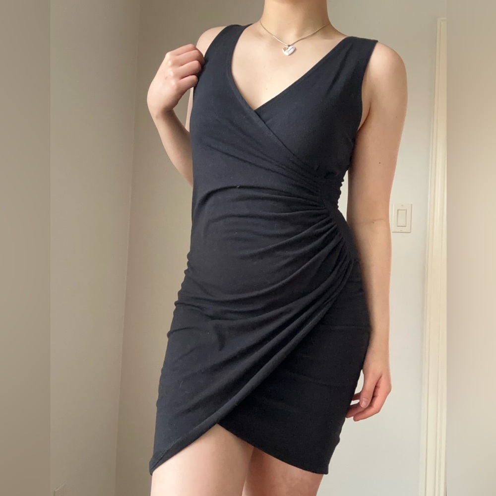 Black mini bodycon dress with a wrap detail #gothicglam #bodycon